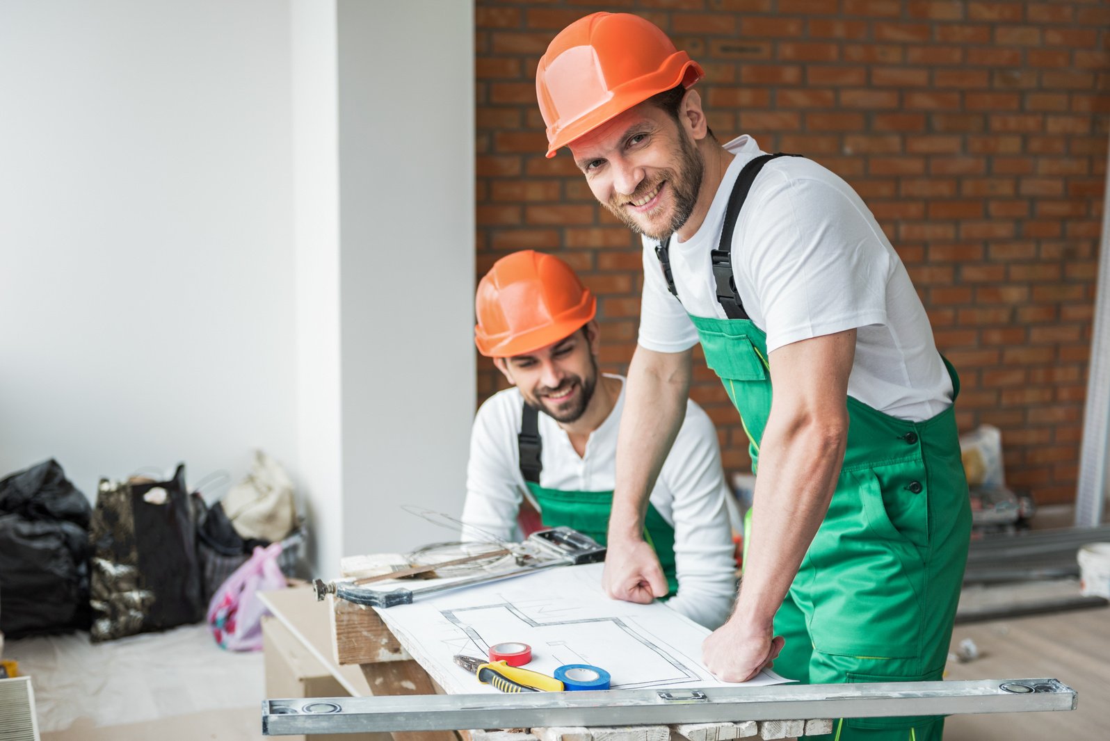 Hilarious busy constructors repairing apartment