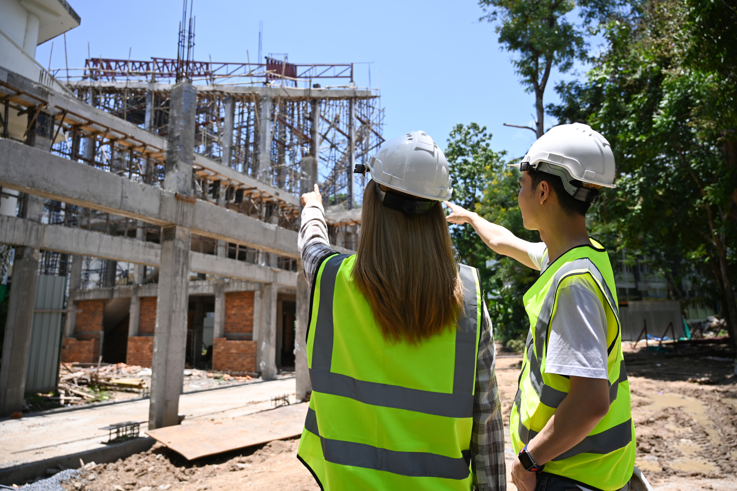 Back view civil engineer discussing, planning development de